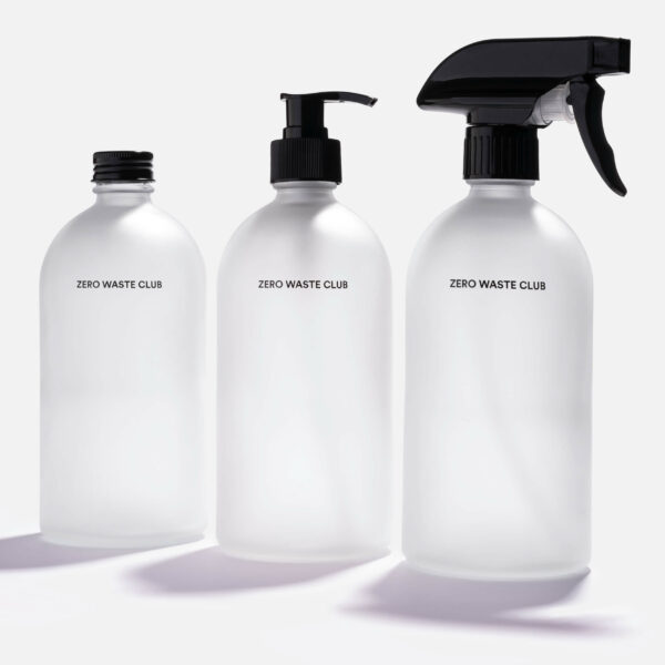 Three glass bottles with spray, screw on, and pump tops